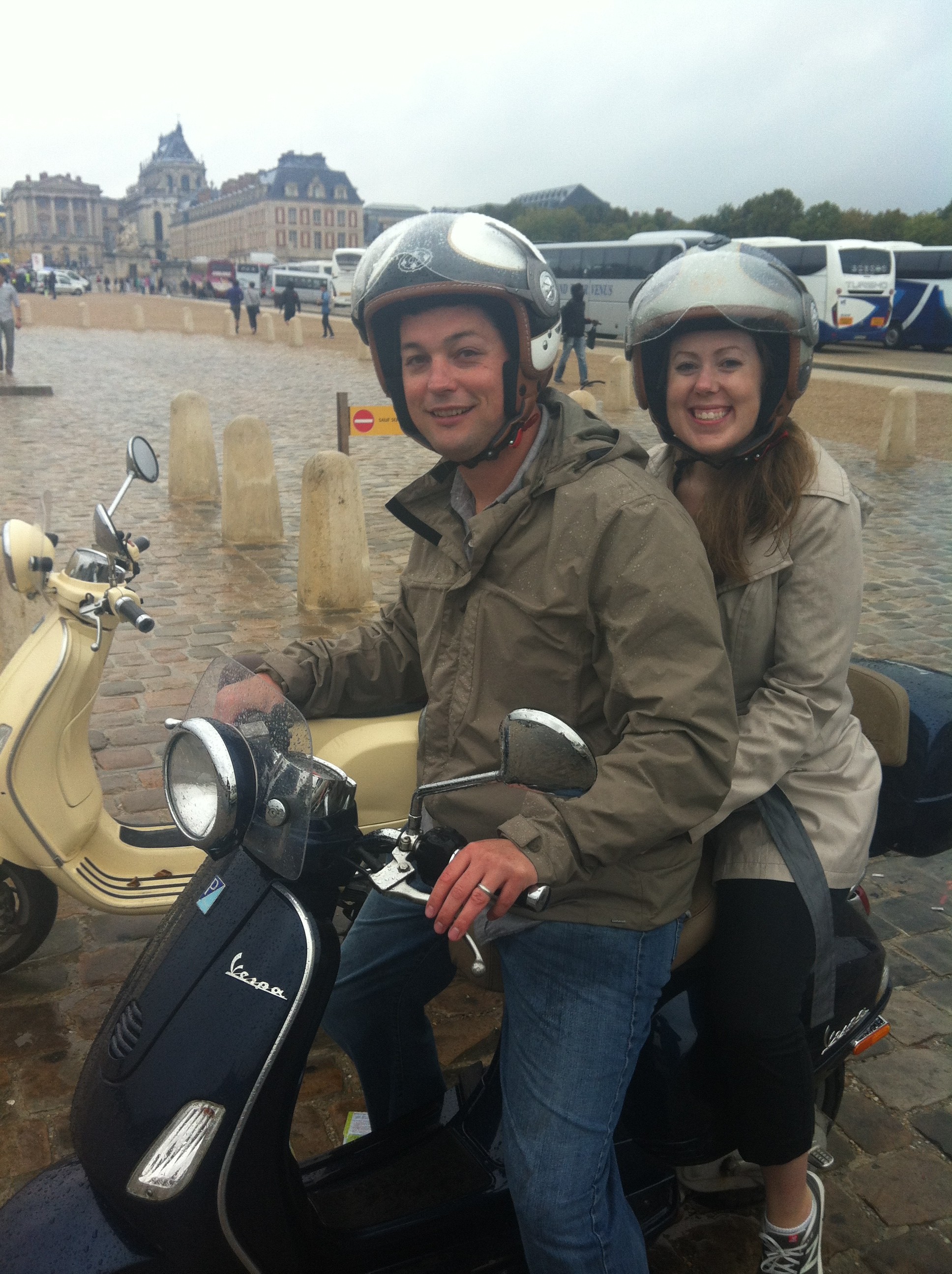 Adam and Melissa at Versailles Palace on their scooter after a Paris to Versailles ride.